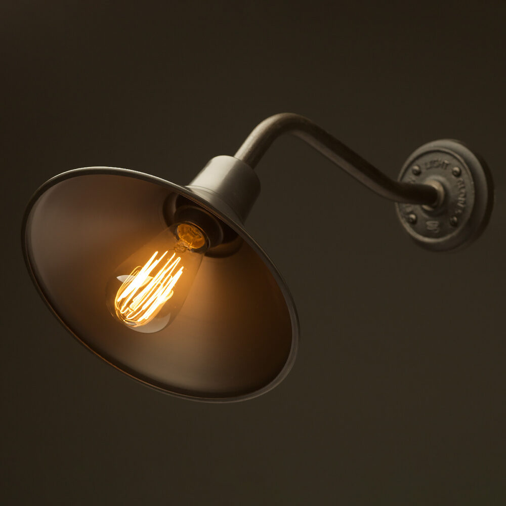 45 bend raw steel plumbing pipe wall light